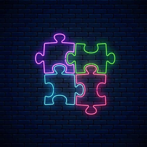Schwarze Mauer mit vier neonfarbenen Puzzleteilen, Foto: Adobe Stock