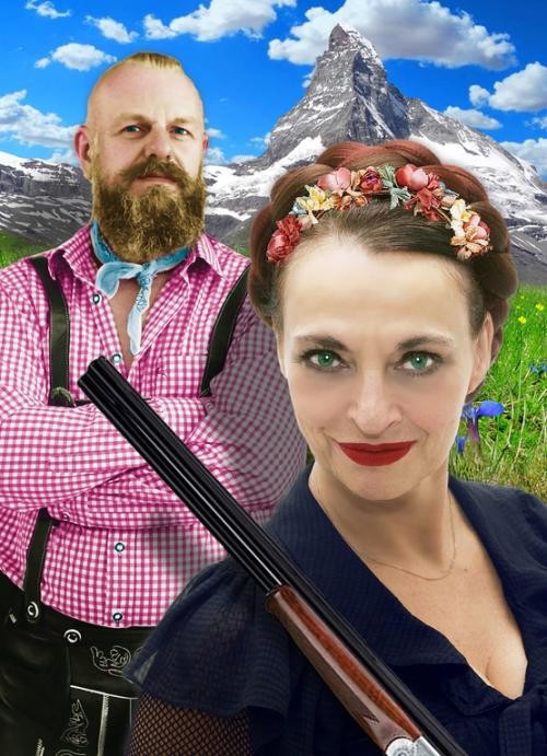 Frau und Mann in Tracht vor Bergkulisse Frau und Mann in Tracht vor Bergkulisse