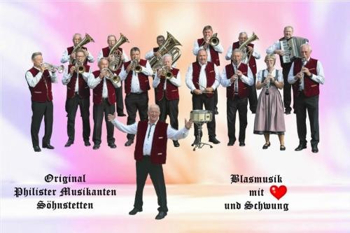 Original Philister Musikanten mit ihren Instrumenten und Dirigent Original Philister Musikanten mit ihren Instrumenten und Dirigent